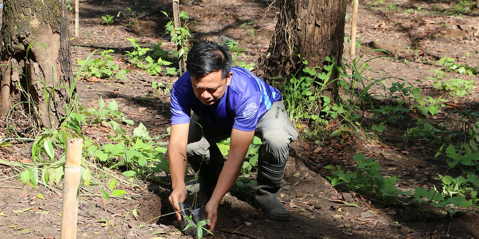 Edgar Caluza, ORM, IMS, and Strategy Manager of Subic EnerZone, actively engages in a tree planting activity, contributing to environmental sustainability efforts.